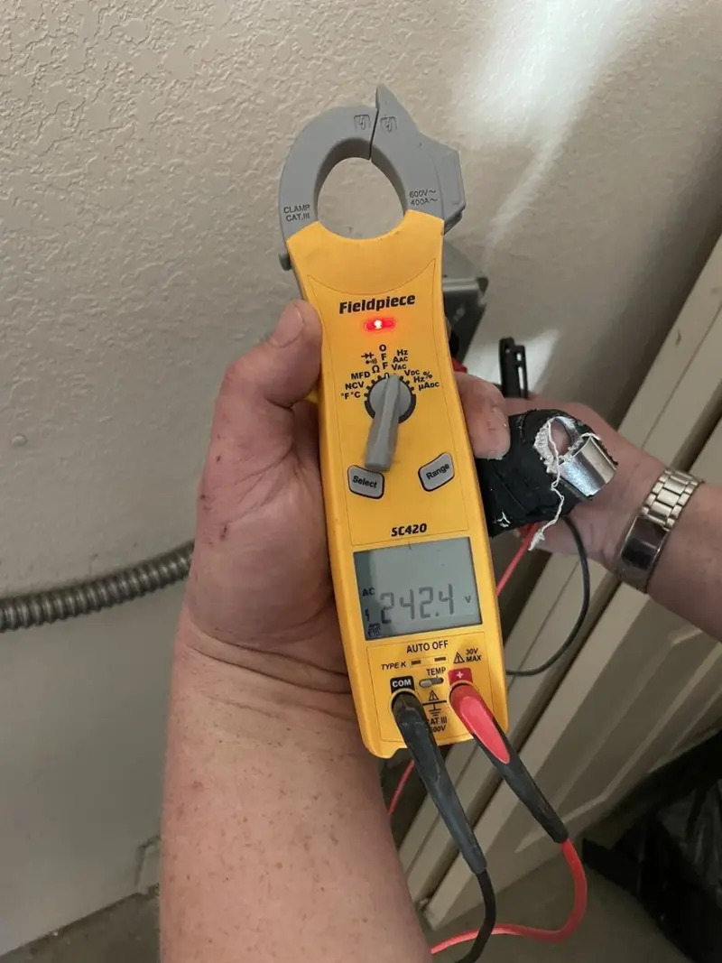 Voltage testing with clamp meter during Ceiling Fan Installation in Greenwich